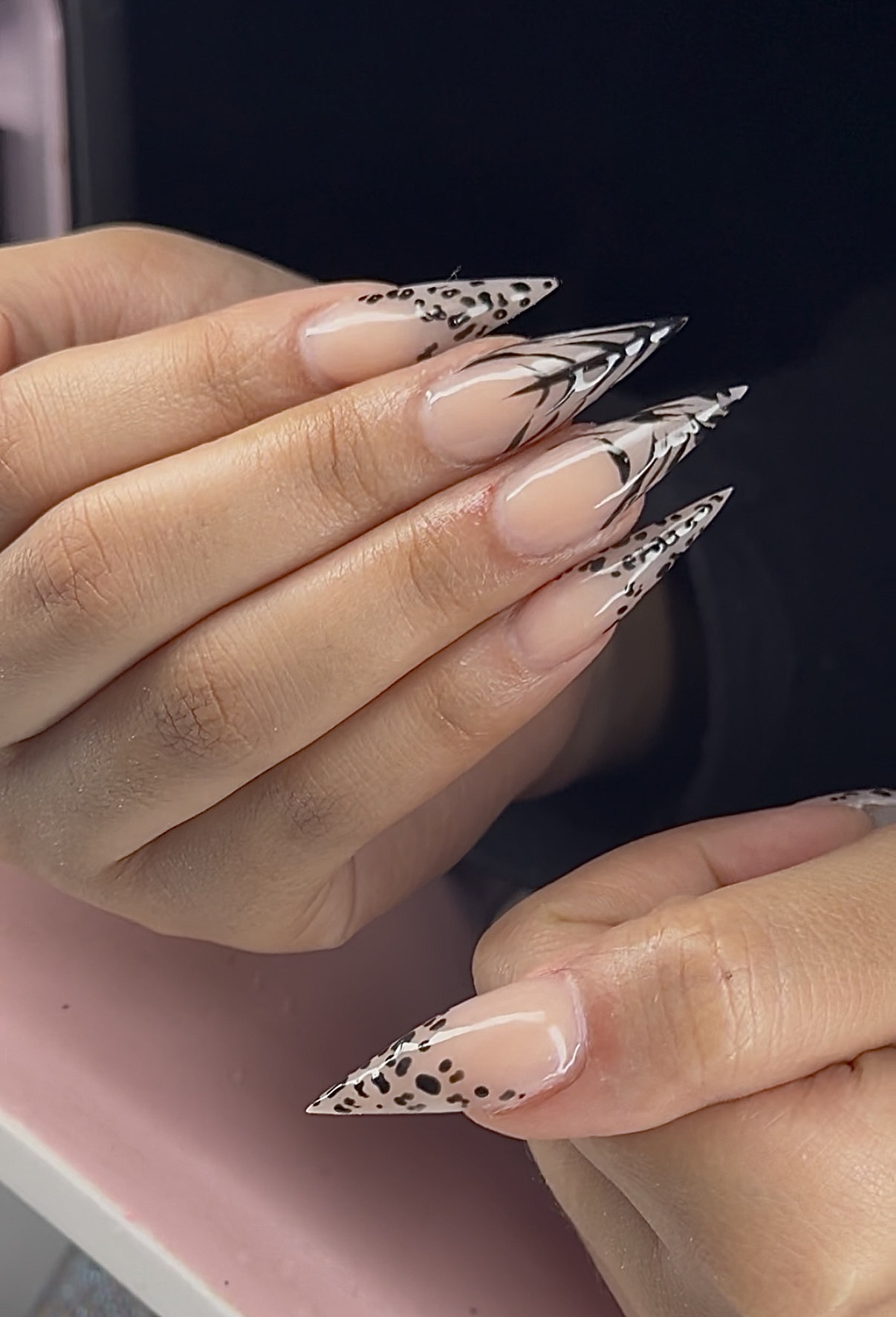 Long stiletto nails with leopard and zebra print details