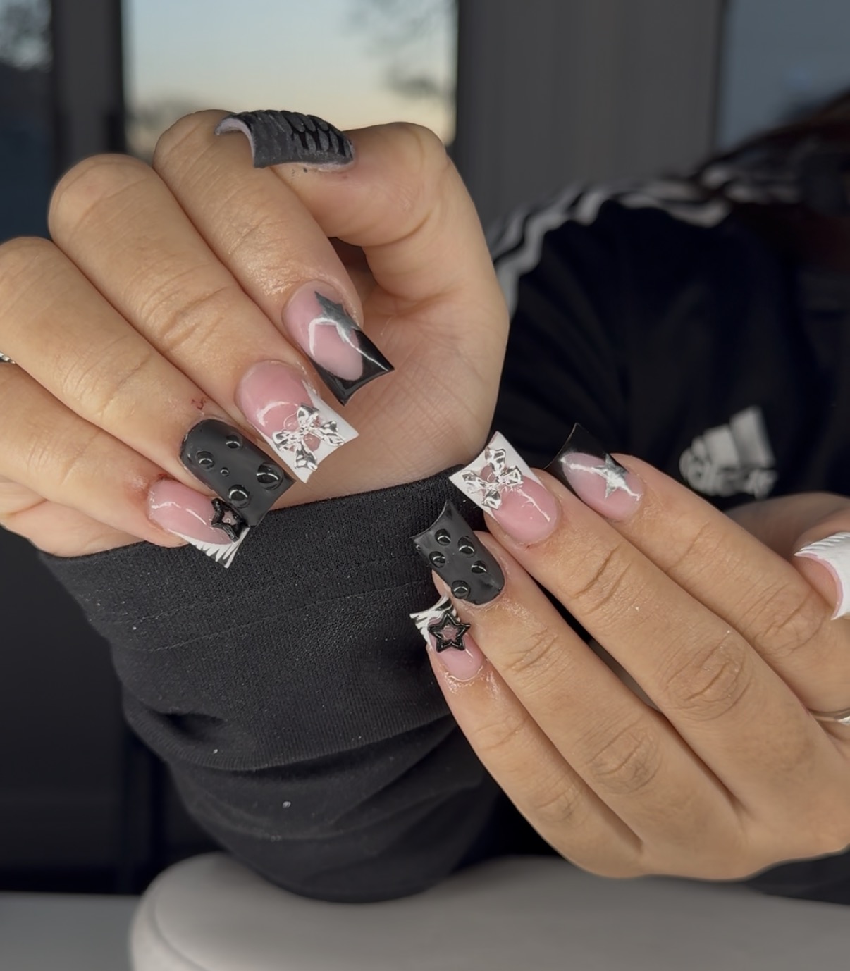 Black and white square nails with bow and textured accent nails