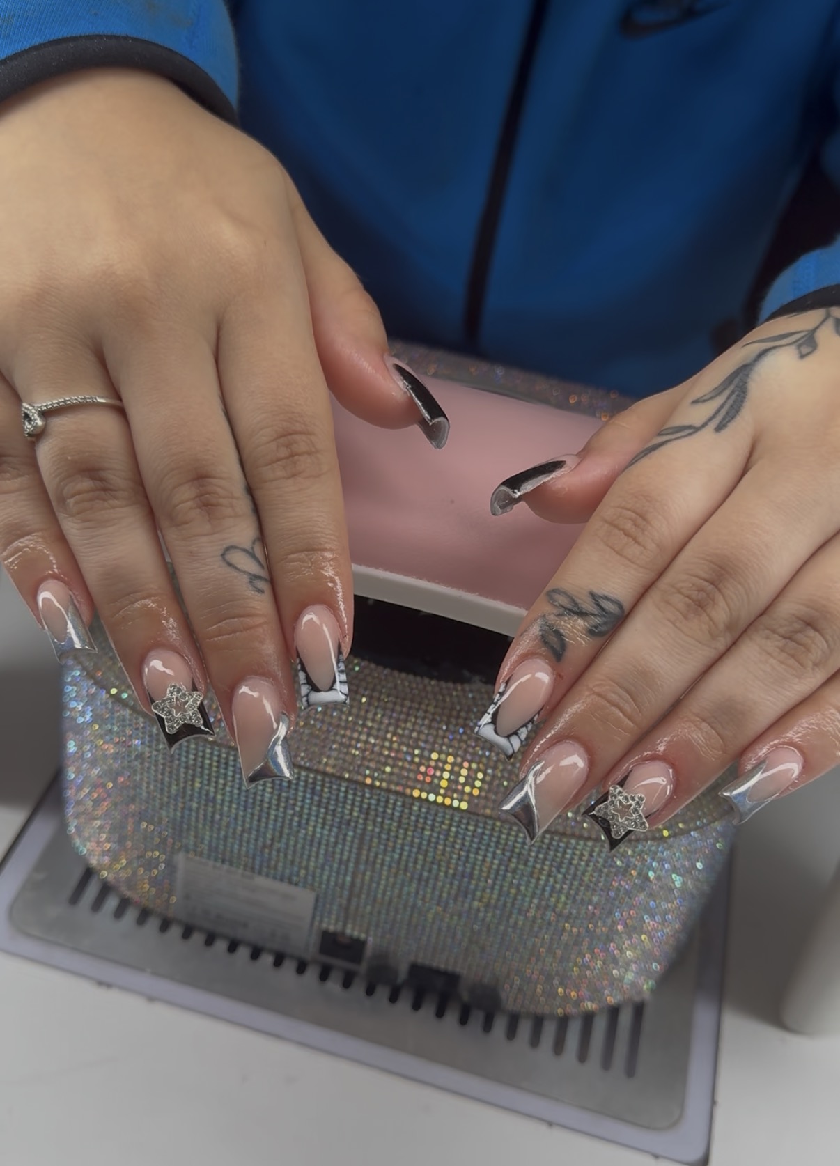 Chrome French nails with star charms