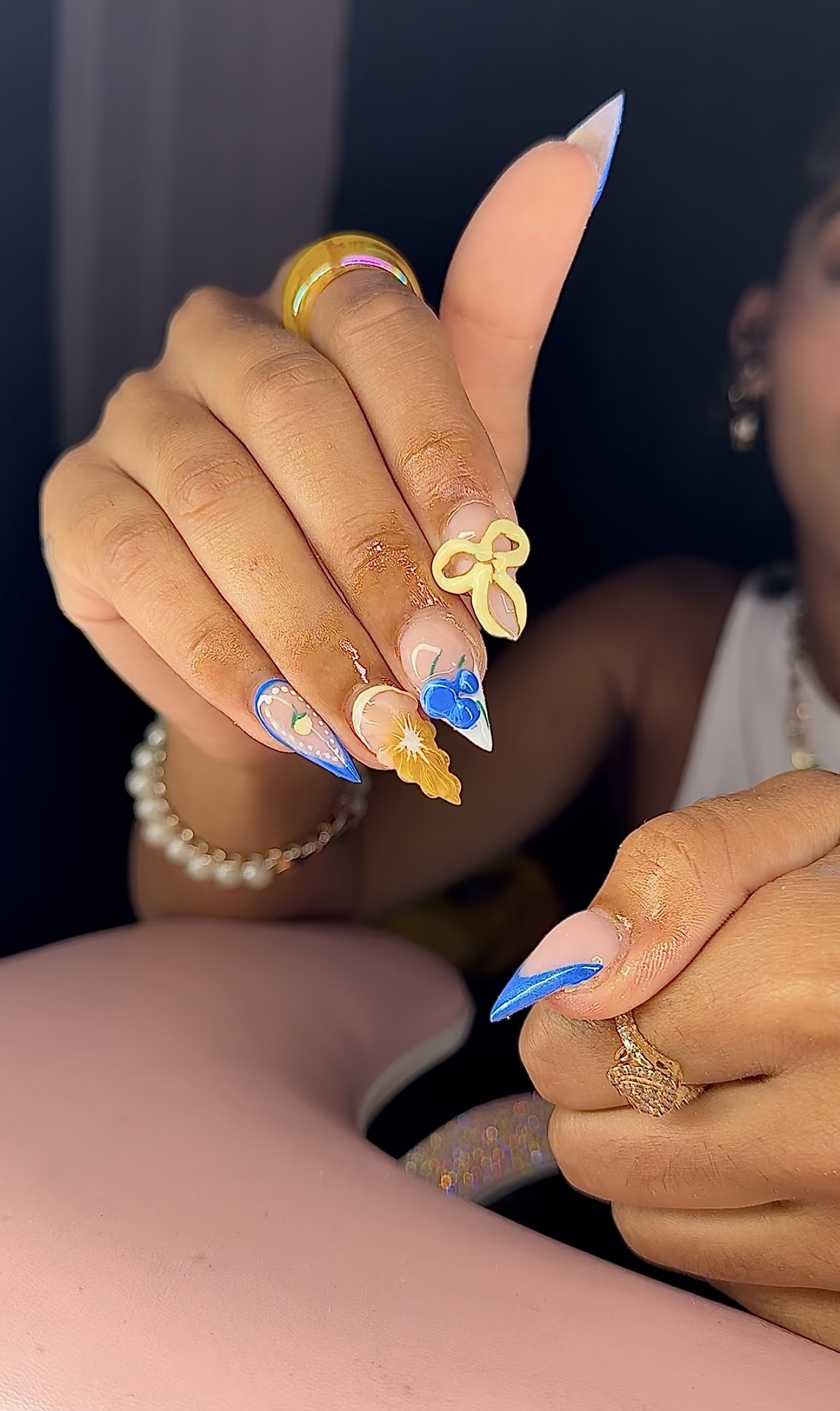 Colorful blue and yellow nail set with 3D charms
